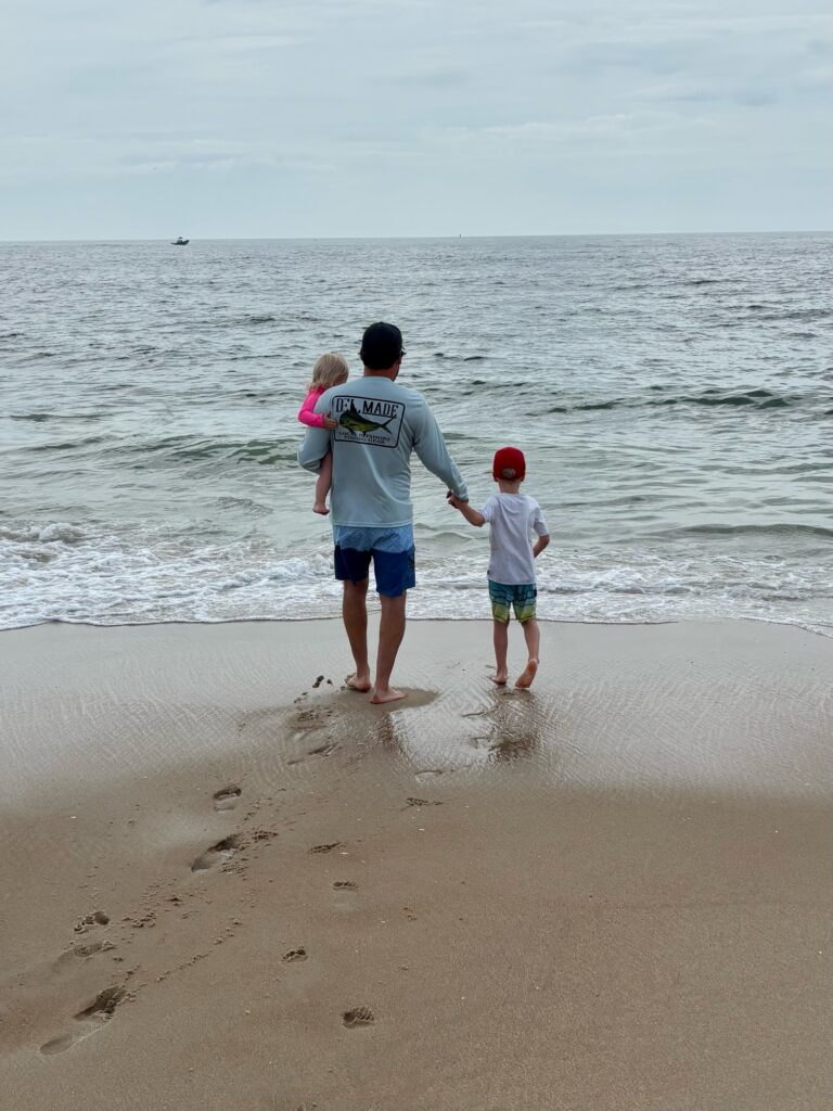 a person and a child on a beach (MyCoast AI)