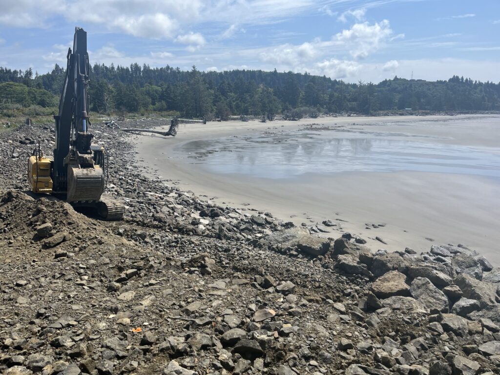 a construction vehicle on a rocky beach (MyCoast AI)