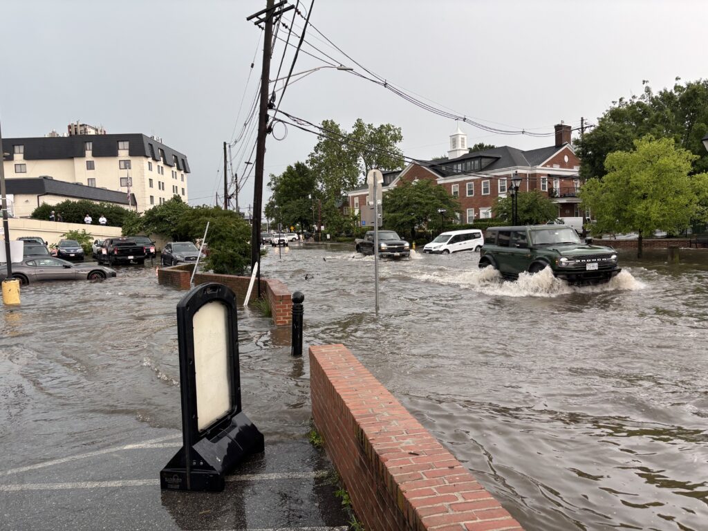 a flooded street with cars (MyCoast AI)