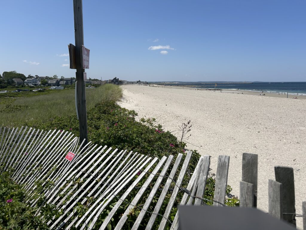 a white fence on a beach (MyCoast AI)