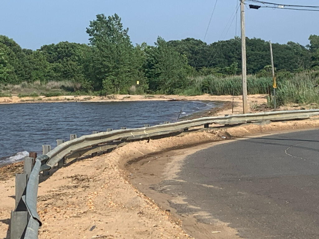 a road next to a body of water (MyCoast AI)