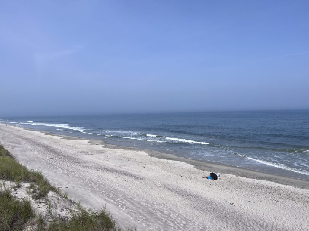 a person lying on a beach (MyCoast AI)