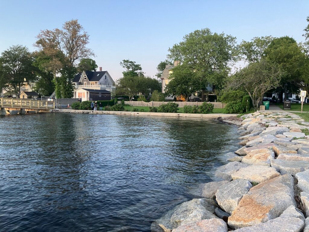 a body of water with rocks and trees around it (MyCoast AI)