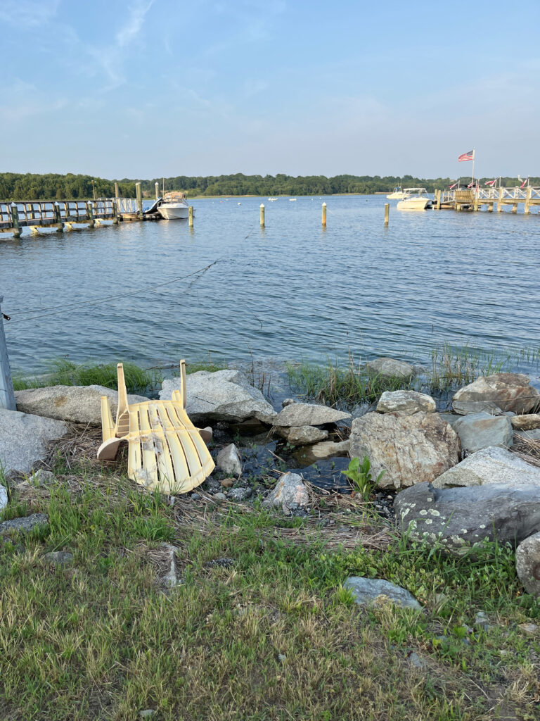 a bench on a rock by a body of water (MyCoast AI)