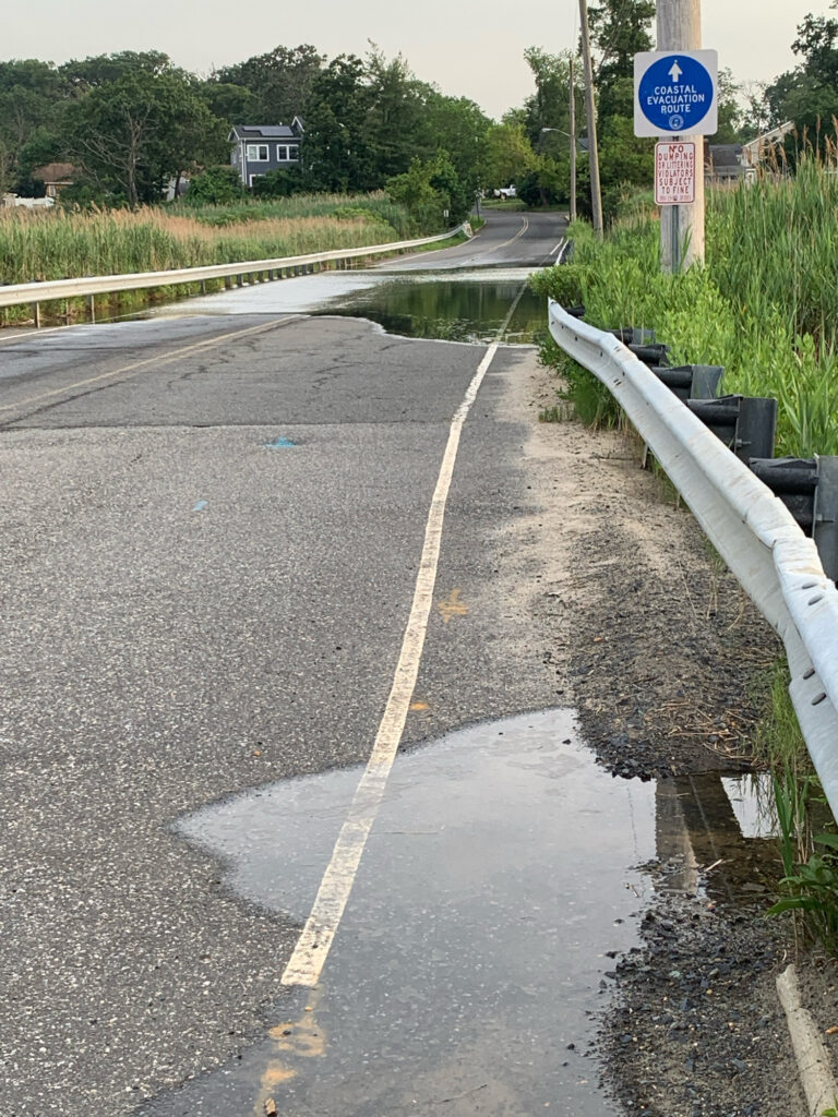 a road with a sign on it (MyCoast AI)