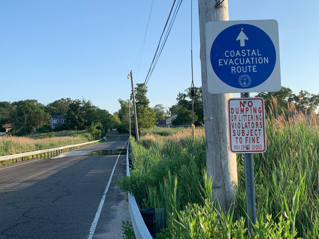 a sign on the side of a road (MyCoast AI)