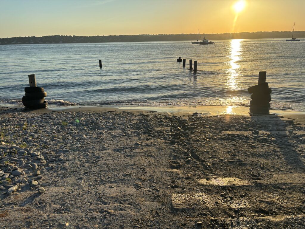 a beach with boats in the water (MyCoast AI)