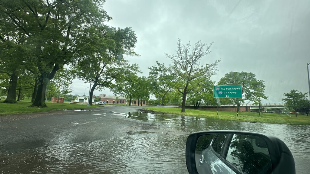 a flooded road with a car (MyCoast AI)