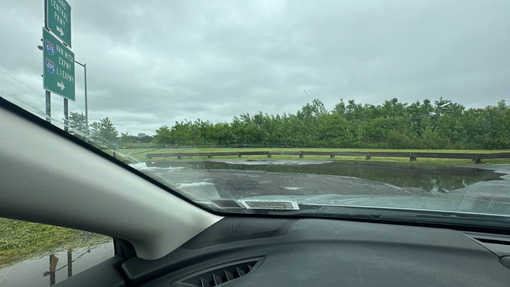 a car driving on a wet road (MyCoast AI)