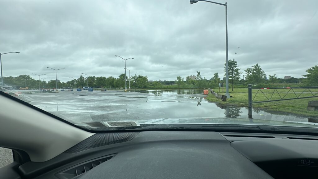 a car driving on a wet road (MyCoast AI)