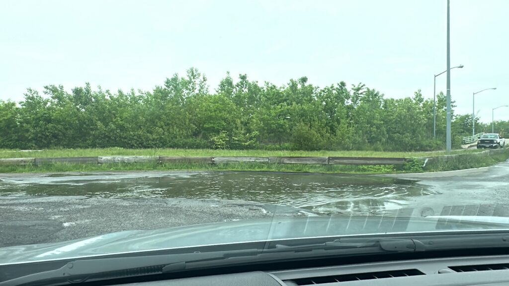 a car driving through a flooded road (MyCoast AI)