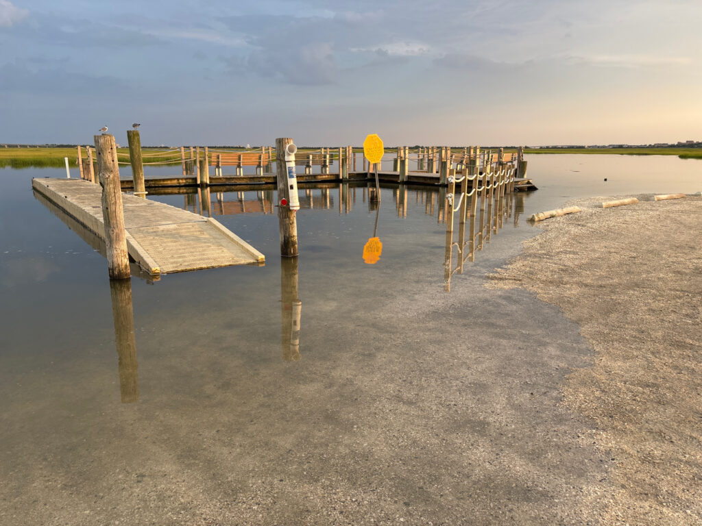 a wooden dock over water (MyCoast AI)