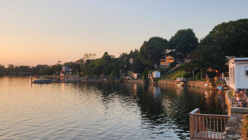 a body of water with trees and buildings around it (MyCoast AI)