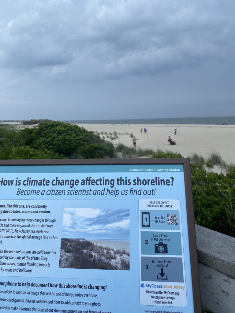 a sign on a beach (MyCoast AI)