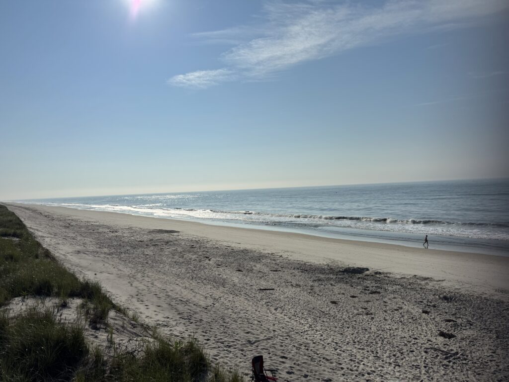 a beach with waves crashing on it (MyCoast AI)