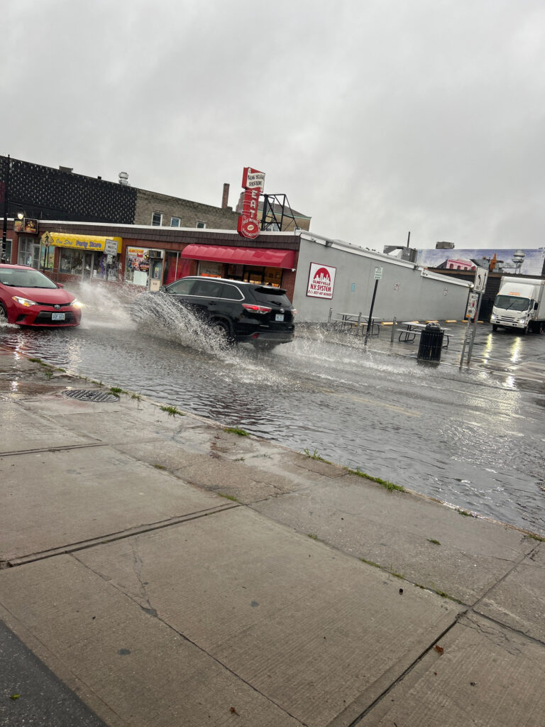 a car on a road with water on the side (MyCoast AI)