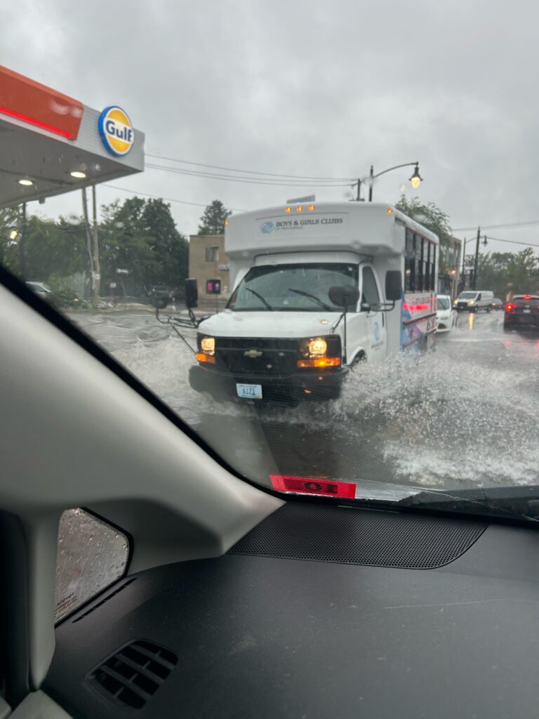 a car driving on a wet road (MyCoast AI)