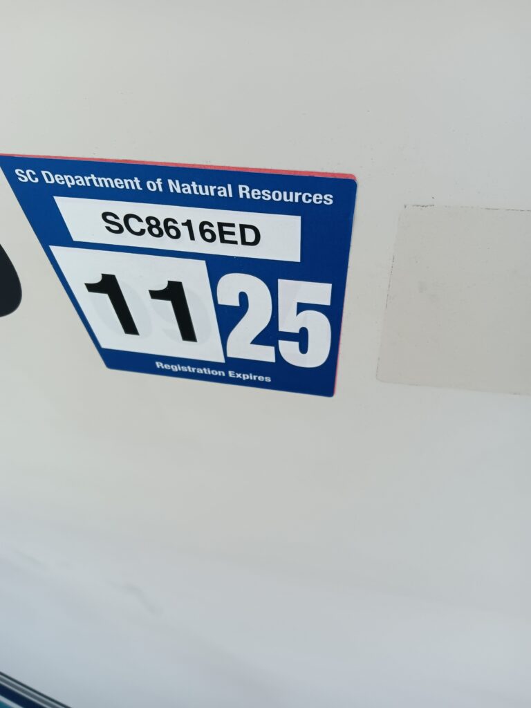 a blue and white sign (MyCoast AI)