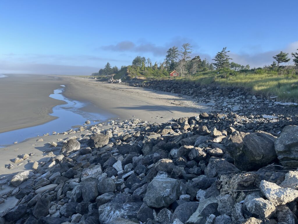 a rocky beach with a sandy beach (MyCoast AI)