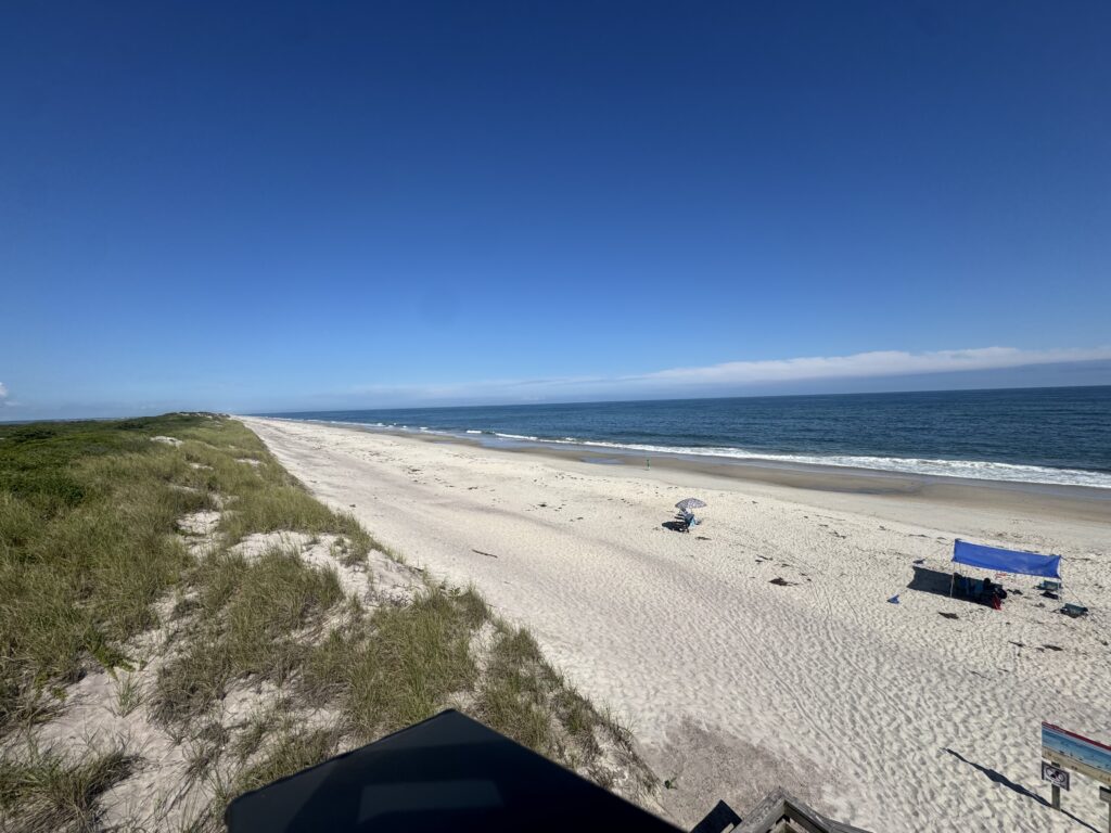 a beach with a few tents (MyCoast AI)