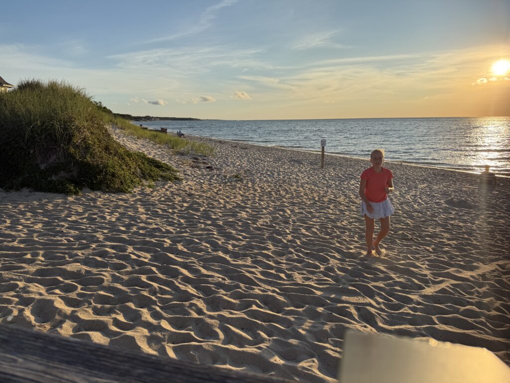 a boy standing on a beach (MyCoast AI)
