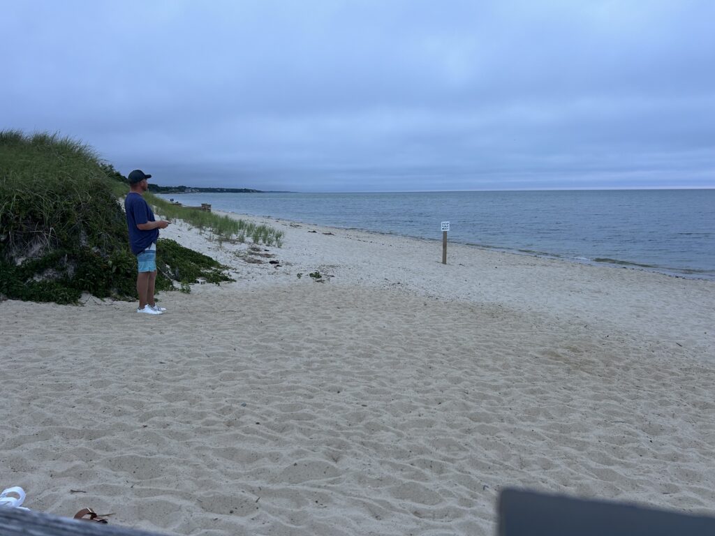 a person standing on a beach (MyCoast AI)