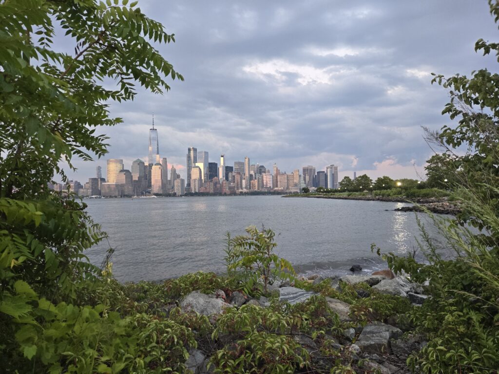 a city skyline across a body of water (MyCoast AI)