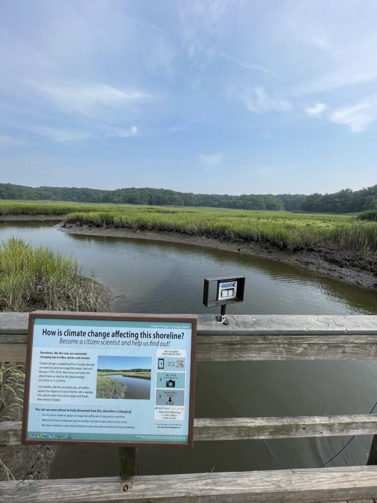 a sign on a wooden dock (MyCoast AI)