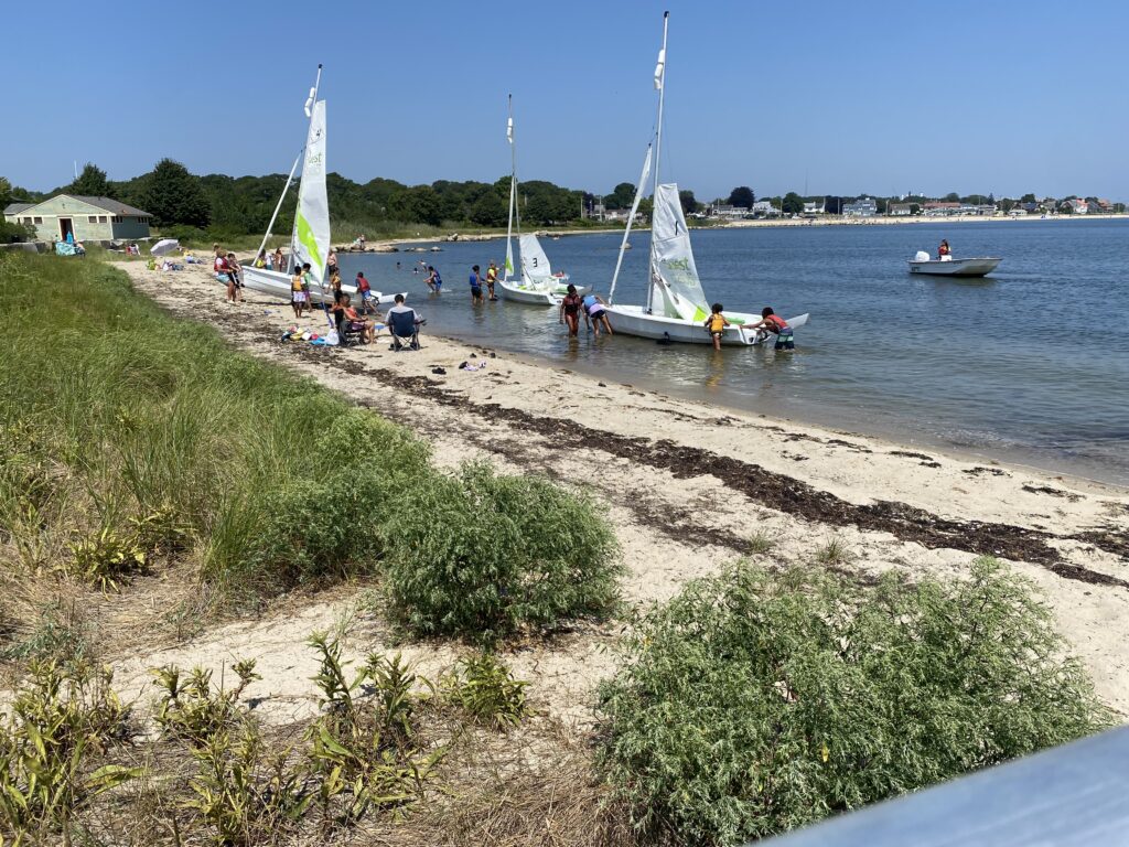 a group of people on a beach (MyCoast AI)
