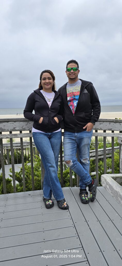 a man and woman posing for a picture on a pier (MyCoast AI)
