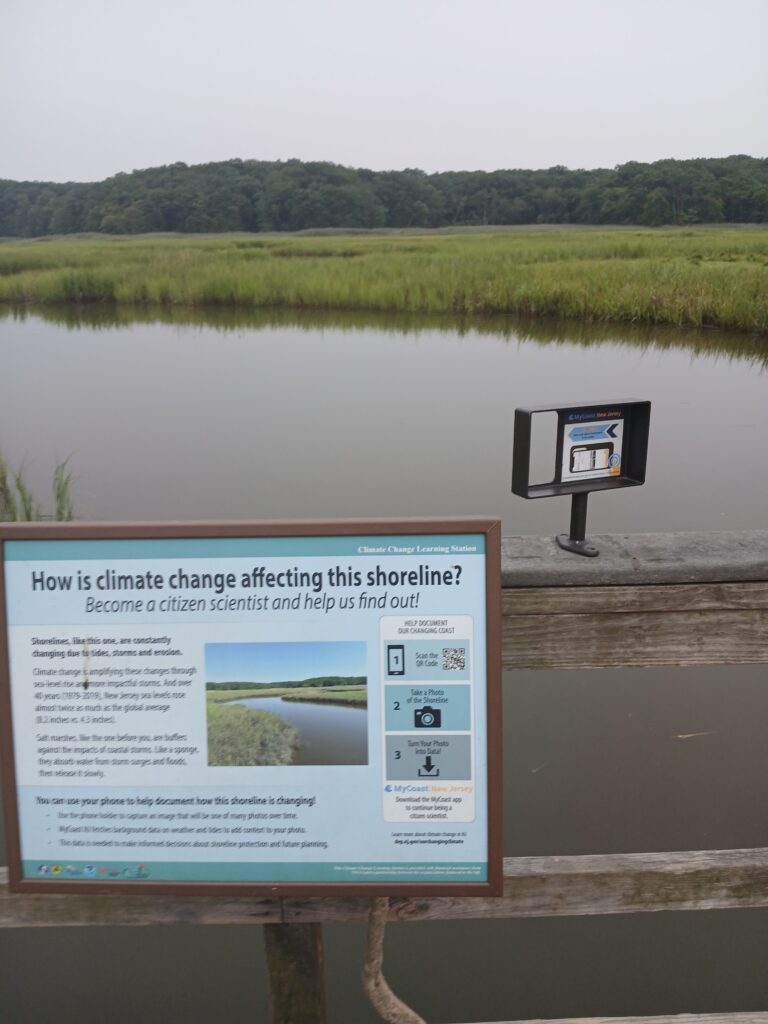 a sign on a wooden dock (MyCoast AI)
