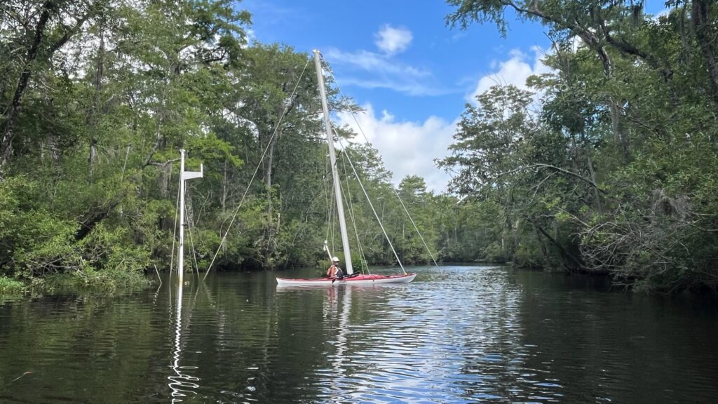 a person in a boat on a river (MyCoast AI)