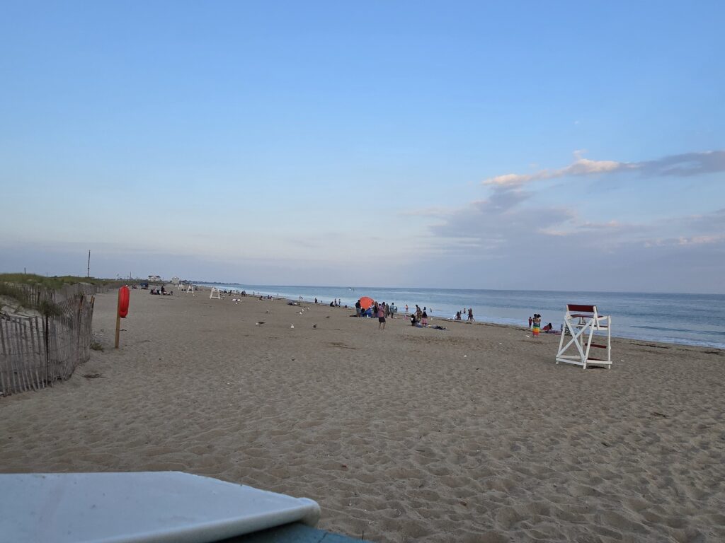 a group of people on a beach (MyCoast AI)