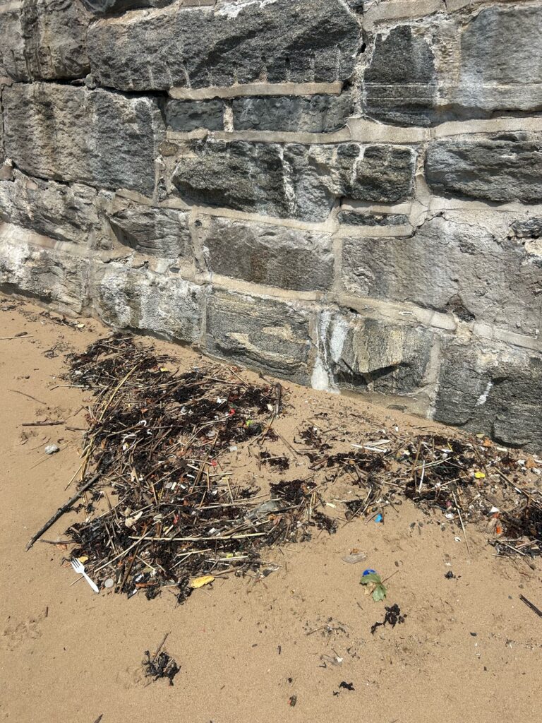 a rock wall with a hole in it (MyCoast AI)