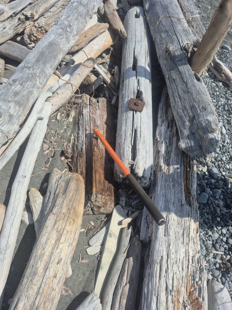 a hammer on a pile of wood (MyCoast AI)