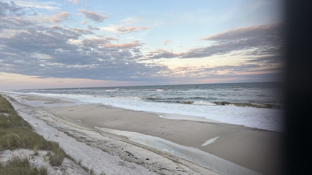 a beach with waves crashing on it (MyCoast AI)