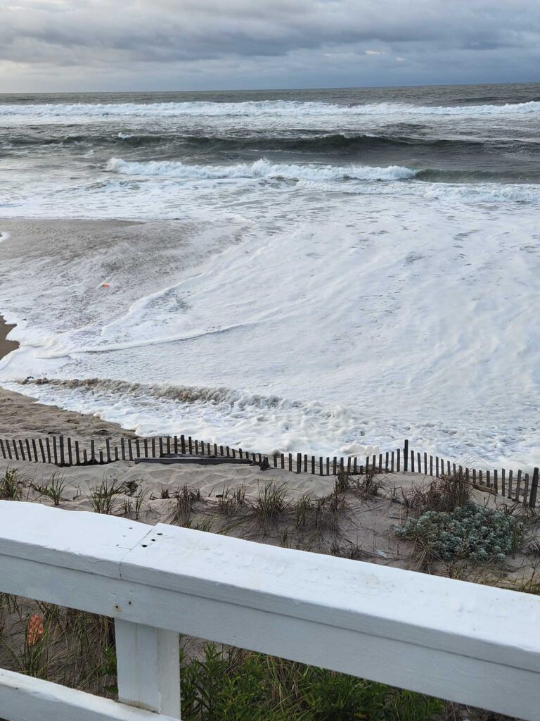 a beach with waves crashing (MyCoast AI)
