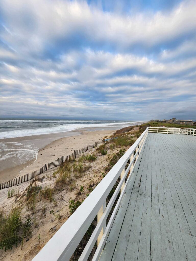 a wooden walkway to a beach (MyCoast AI)