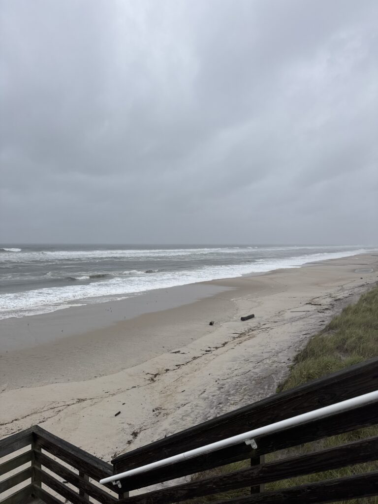 a beach with waves crashing on it (MyCoast AI)