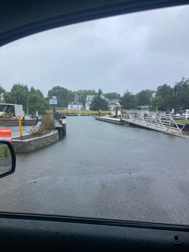a view of a dock and a lake from a car (MyCoast AI)