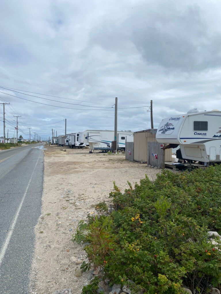 a road with a truck and trailers on it (MyCoast AI)