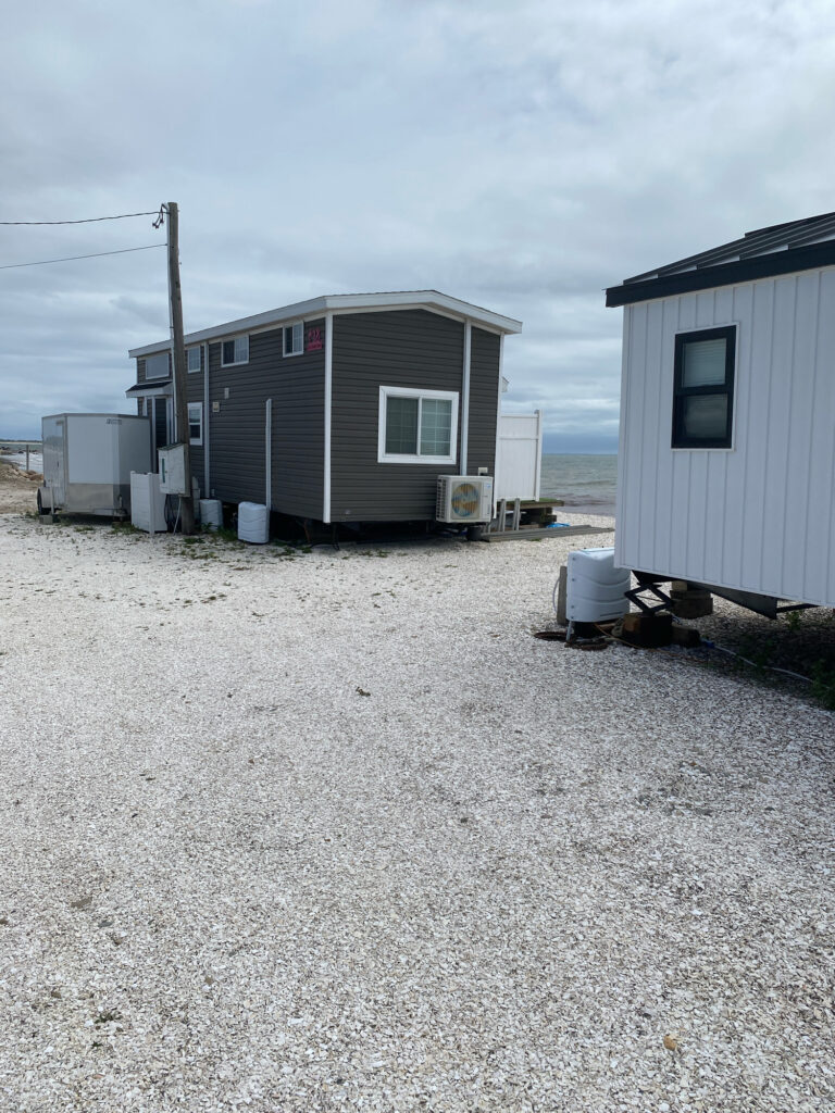 a house with a gravel yard (MyCoast AI)