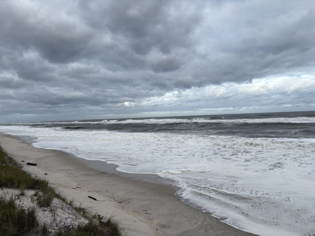 a beach with waves crashing on it (MyCoast AI)