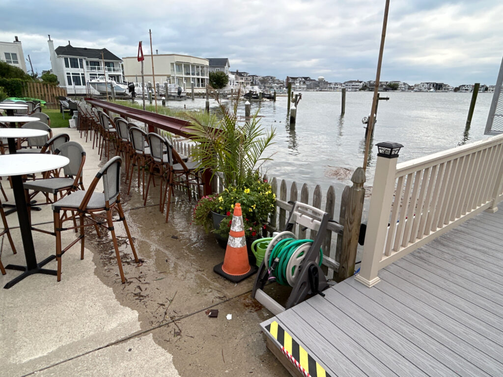 tables and chairs on a deck (MyCoast AI)