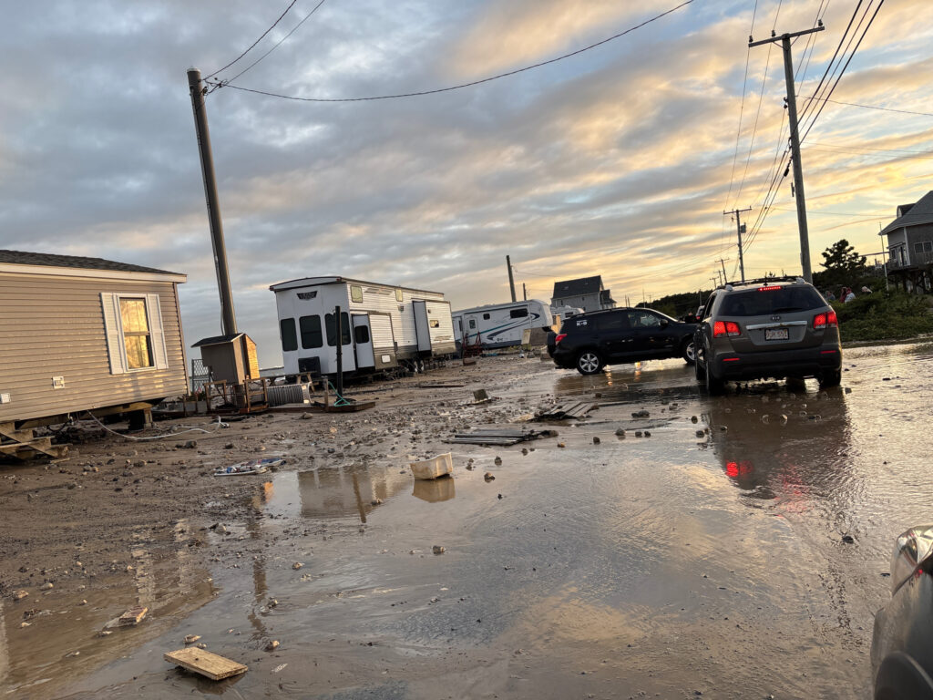 a flooded street with cars and buildings (MyCoast AI)