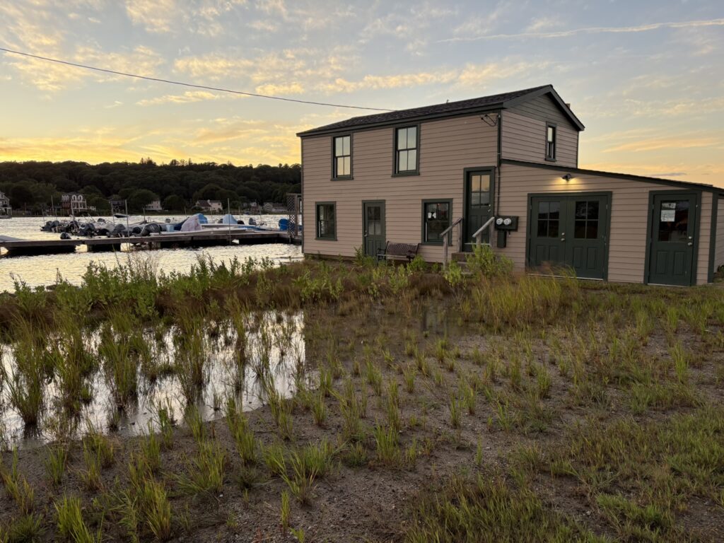 a house with a boat in the water (MyCoast AI)