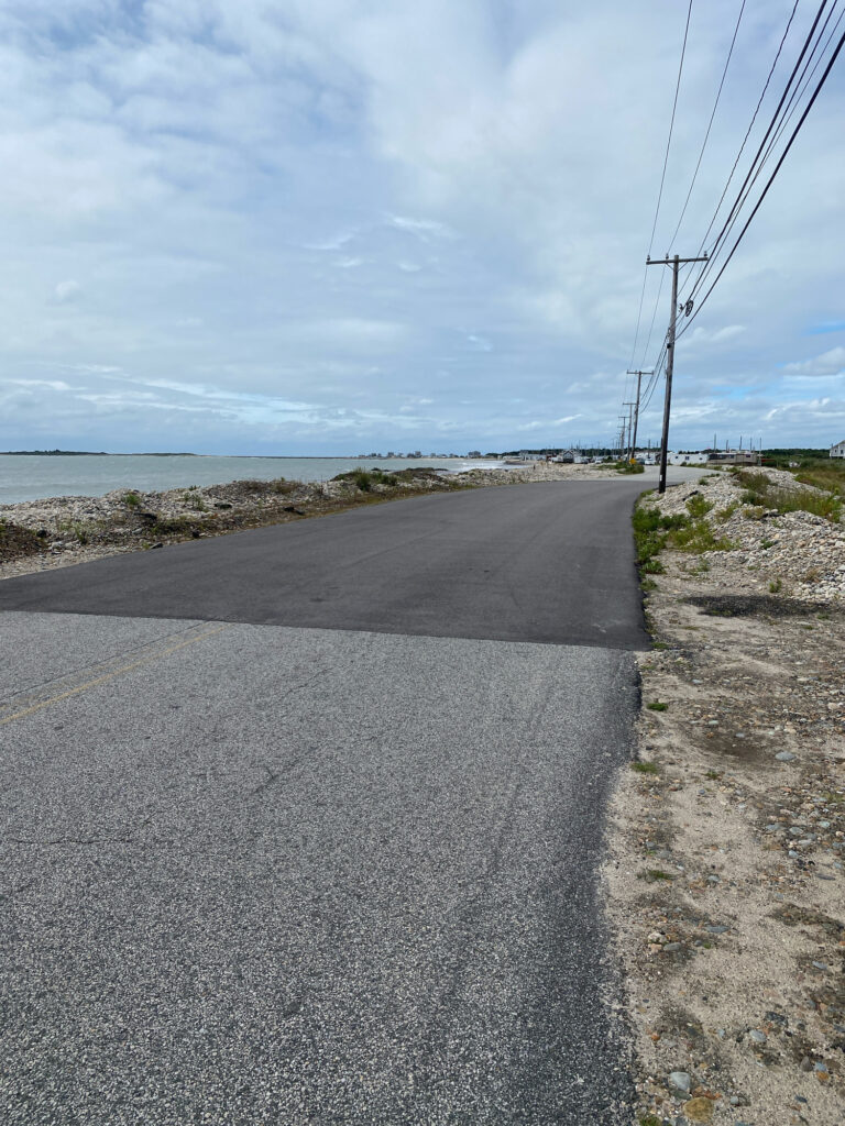a road next to a body of water (MyCoast AI)