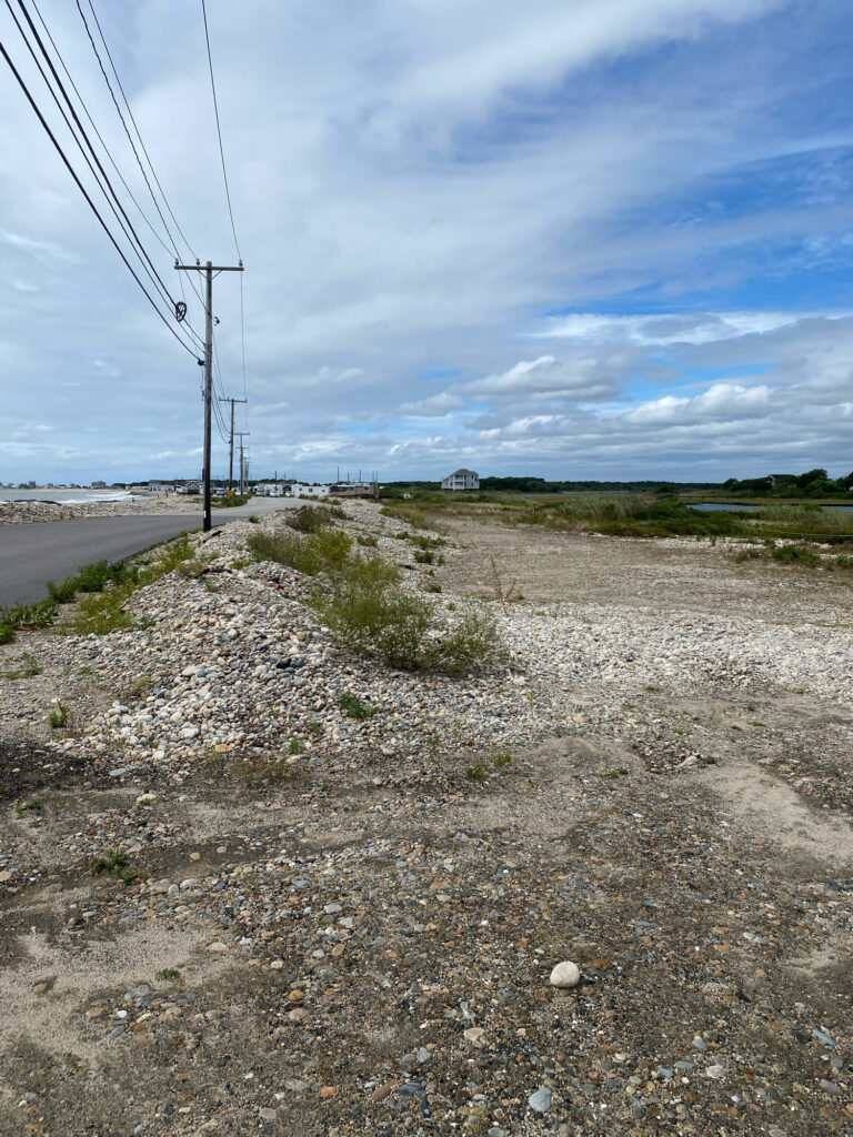 a dirt road with power lines on the side (MyCoast AI)