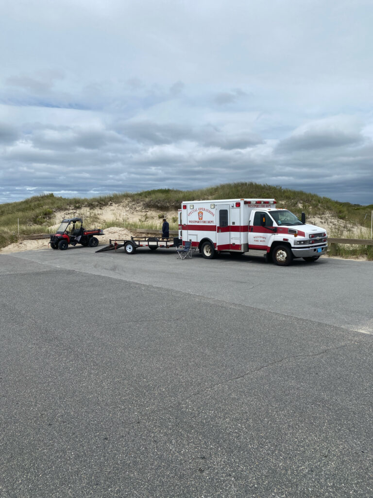 a white truck towing a car (MyCoast AI)