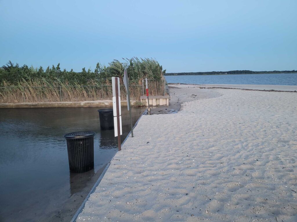 a sandy beach with a trash can (MyCoast AI)